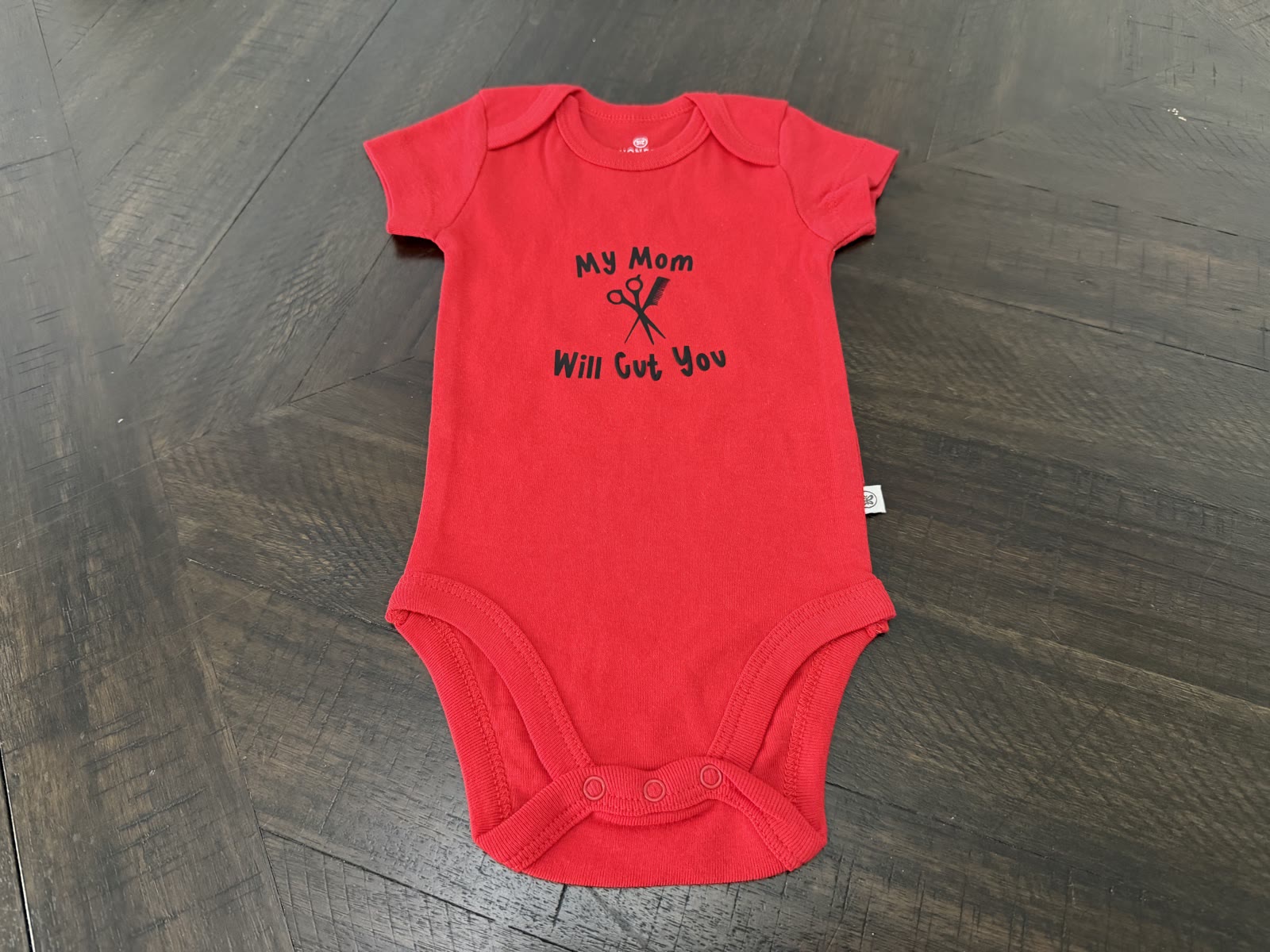 Custom “My Mom Will Cut You” onesie by Heather